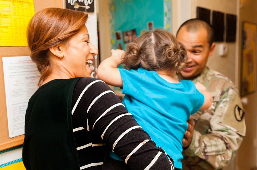 Service Member picking up child from CDC